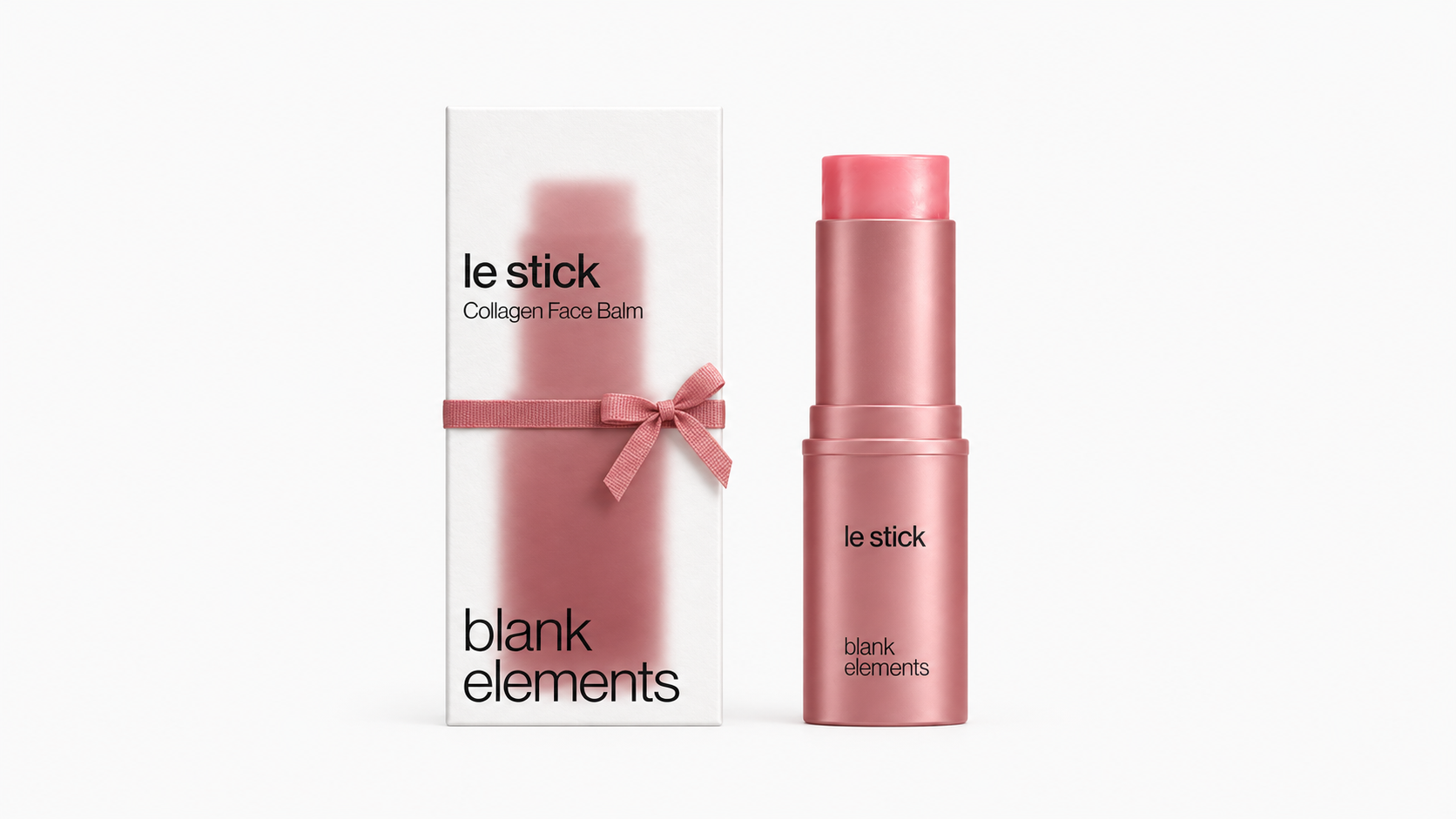 Pink Le Stick beside its chalk carton tied with a pink ribbon
